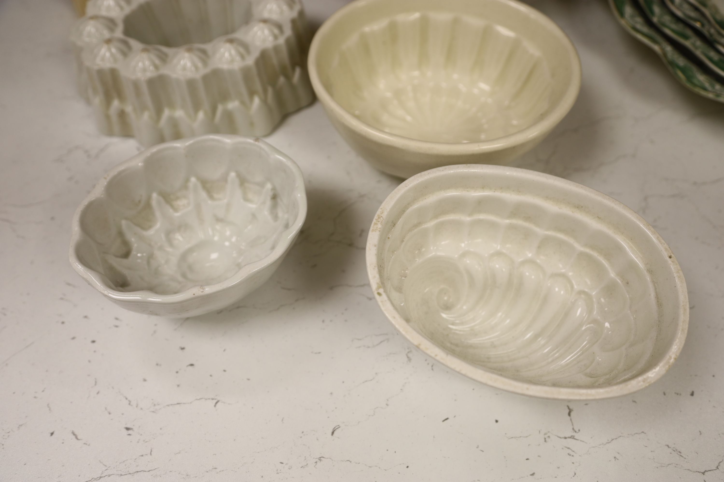 Six pottery jelly moulds including one Shelley